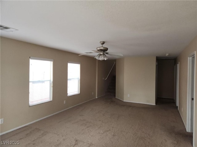 5052 Whistling Acres Ave, Las Vegas, NV 89131 - unfurnished room featuring carpet flooring, stairway, ceiling fan, and baseboards