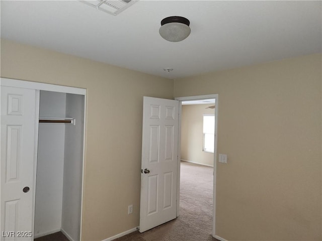 5052 Whistling Acres Ave, Las Vegas, NV 89131 - unfurnished bedroom featuring carpet floors, baseboards, and a closet