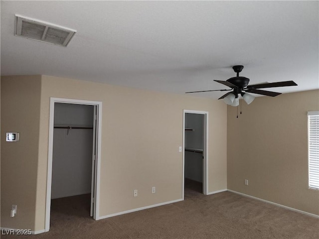 5052 Whistling Acres Ave, Las Vegas, NV 89131 - unfurnished bedroom featuring a spacious closet, a closet, carpet flooring, ceiling fan, and baseboards