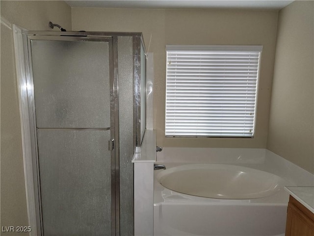5052 Whistling Acres Ave, Las Vegas, NV 89131 - full bath with a stall shower, a bath, and vanity