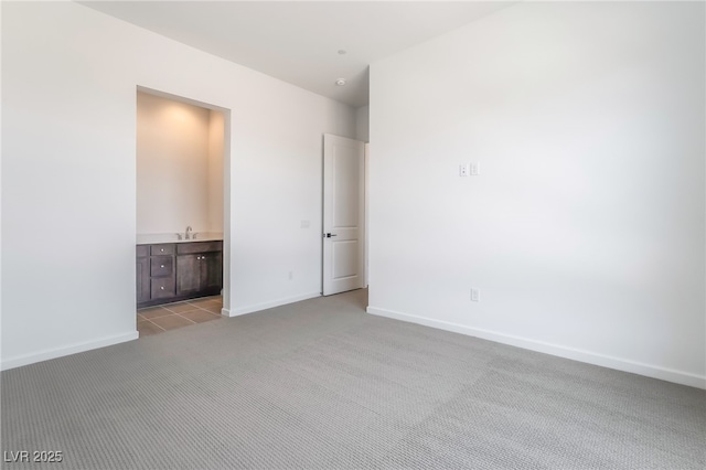 2501 Indigo Mountain St, Henderson, NV 89044 - unfurnished bedroom featuring carpet floors, baseboards, a sink, and connected bathroom
