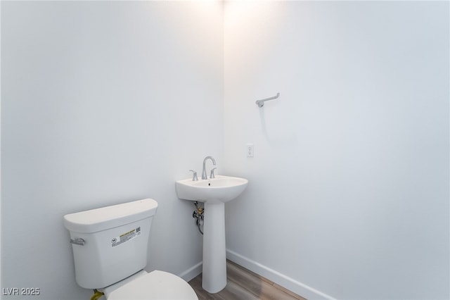 2501 Indigo Mountain St, Henderson, NV 89044 - bathroom featuring toilet, baseboards, and wood finished floors