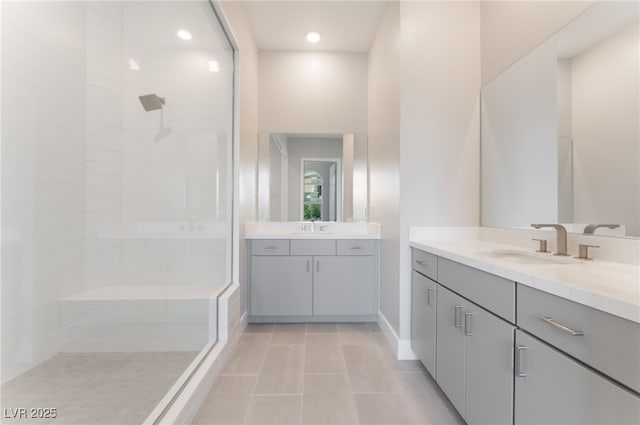 128 Los Cabos Dr Unit 301, Las Vegas, NV 89144 - full bath featuring tiled shower, two vanities, tile patterned flooring, and recessed lighting