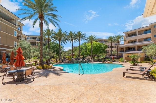 128 Los Cabos Dr Unit 301, Las Vegas, NV 89144 - community pool featuring a patio