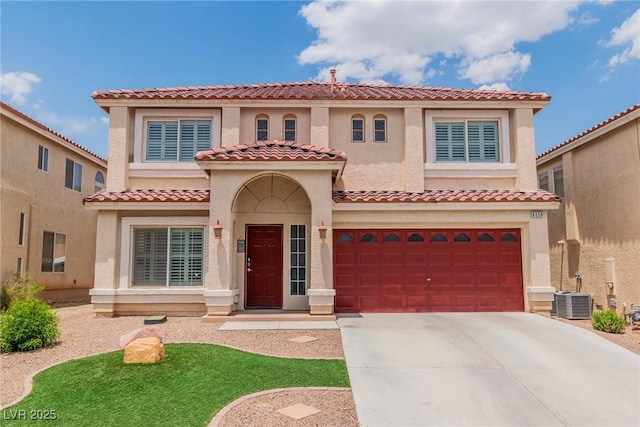 6558 Musette Ave, Las Vegas, NV 89139 - mediterranean / spanish home with a garage, concrete driveway, stucco siding, and a tiled roof