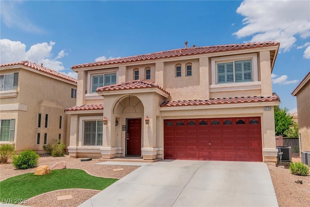 6558 Musette Ave, Las Vegas, NV 89139 - mediterranean / spanish-style home with concrete driveway, an attached garage, stucco siding, a tile roof, and cooling unit