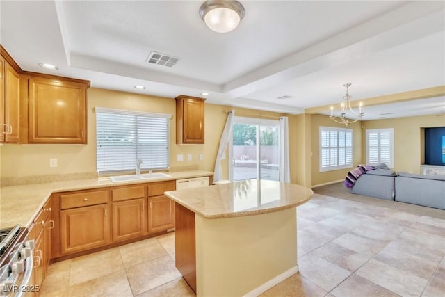 6558 Musette Ave, Las Vegas, NV 89139 - kitchen with a sink, a tray ceiling, open floor plan, stainless steel range, and light tile patterned floors