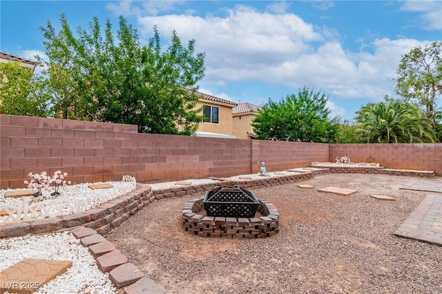 6558 Musette Ave, Las Vegas, NV 89139 - fenced backyard featuring a fire pit