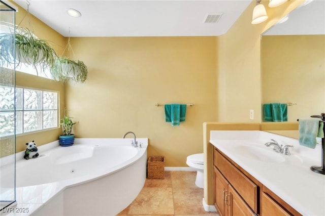 6558 Musette Ave, Las Vegas, NV 89139 - full bathroom with toilet, vanity, a garden tub, baseboards, and tile patterned flooring
