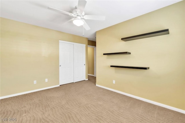 6558 Musette Ave, Las Vegas, NV 89139 - unfurnished bedroom with baseboards, carpet flooring, a closet, and a ceiling fan