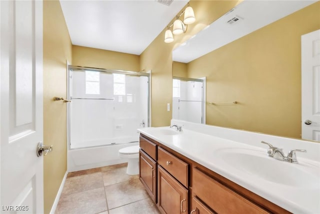6558 Musette Ave, Las Vegas, NV 89139 - bathroom featuring toilet, double vanity, baseboards, tub / shower combination, and tile patterned floors