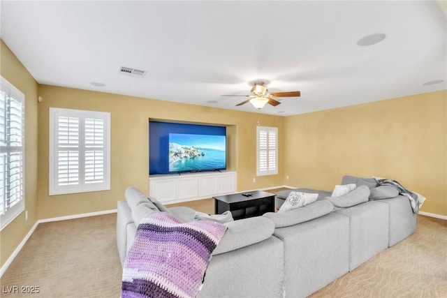 6558 Musette Ave, Las Vegas, NV 89139 - living room with carpet, a ceiling fan, baseboards, and healthy amount of natural light