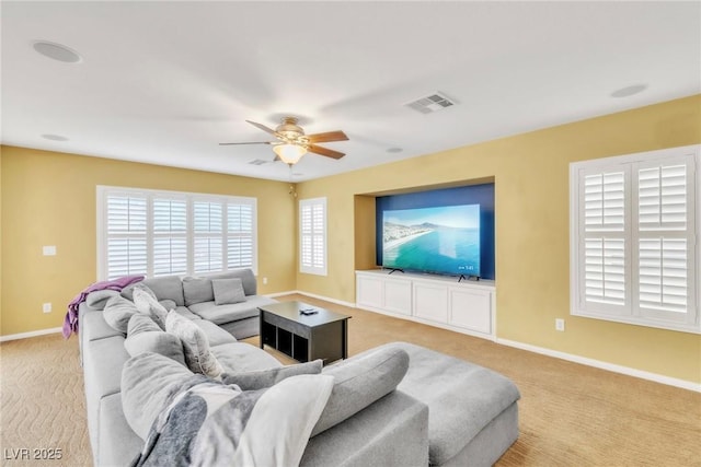6558 Musette Ave, Las Vegas, NV 89139 - living area with light carpet, a ceiling fan, and baseboards