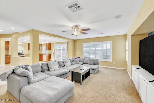 6558 Musette Ave, Las Vegas, NV 89139 - living area featuring a chandelier, a ceiling fan, baseboards, and light carpet