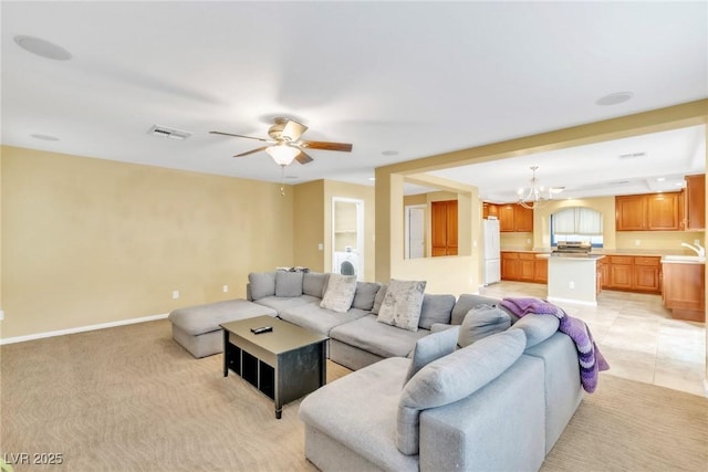 6558 Musette Ave, Las Vegas, NV 89139 - living room with a chandelier, ceiling fan, washer / dryer, and baseboards