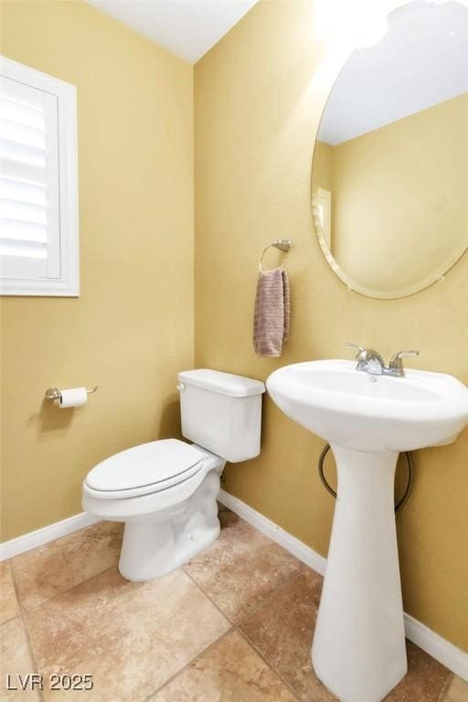 6558 Musette Ave, Las Vegas, NV 89139 - bathroom featuring toilet, baseboards, a sink, and tile patterned floors