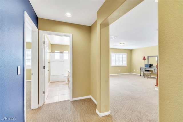 6558 Musette Ave, Las Vegas, NV 89139 - hallway featuring carpet floors, baseboards, a desk, and a textured wall