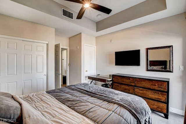 83 E Agate Ave Unit 207, Las Vegas, NV 89123 - bedroom featuring a closet, a ceiling fan, and a raised ceiling