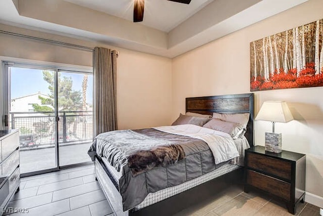83 E Agate Ave Unit 207, Las Vegas, NV 89123 - bedroom featuring access to outside, light tile patterned floors, a raised ceiling, and ceiling fan