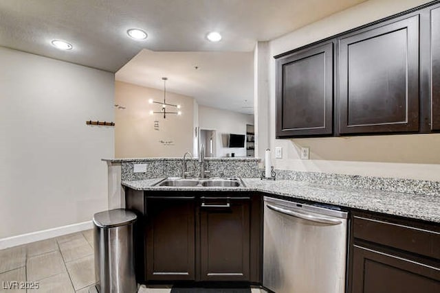 83 E Agate Ave Unit 207, Las Vegas, NV 89123 - kitchen featuring dishwasher, dark brown cabinetry, a peninsula, light stone counters, and recessed lighting