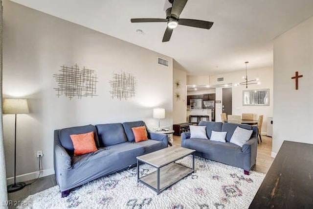 83 E Agate Ave Unit 207, Las Vegas, NV 89123 - living area featuring a ceiling fan and a chandelier