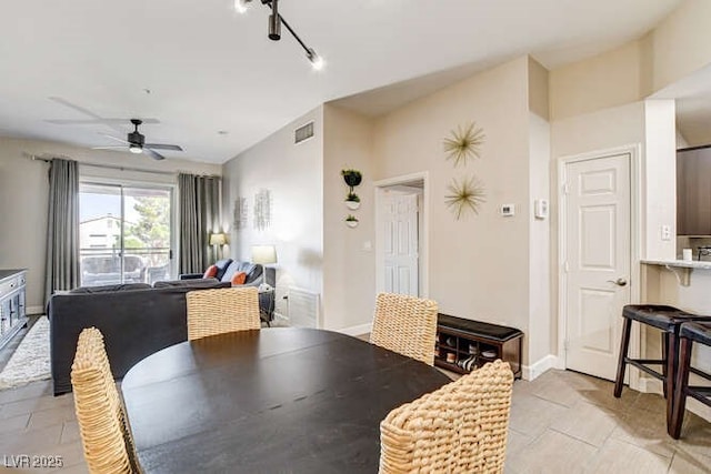 83 E Agate Ave Unit 207, Las Vegas, NV 89123 - dining room with light tile patterned floors and ceiling fan