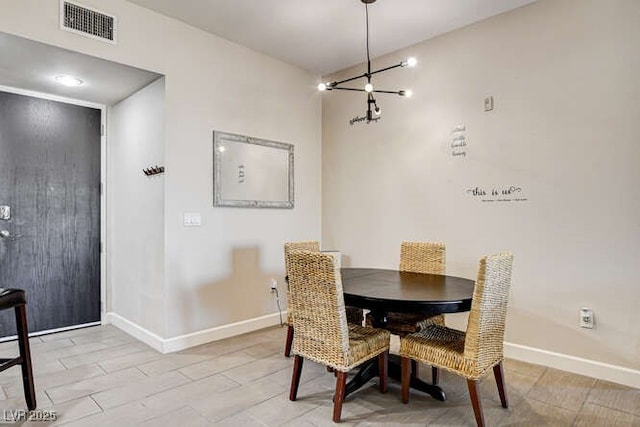83 E Agate Ave Unit 207, Las Vegas, NV 89123 - dining room featuring baseboards and a chandelier