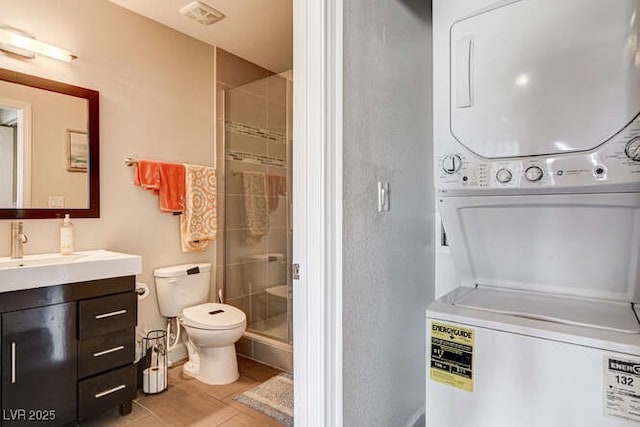 83 E Agate Ave Unit 207, Las Vegas, NV 89123 - full bath featuring stacked washing machine and dryer, vanity, and a stall shower