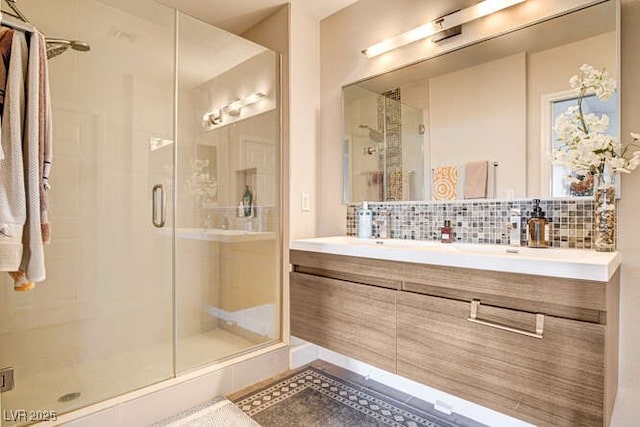 83 E Agate Ave Unit 207, Las Vegas, NV 89123 - full bathroom with a stall shower, decorative backsplash, and double vanity