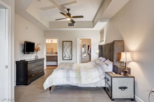 83 E Agate Ave Unit 207, Las Vegas, NV 89123 - bedroom with a raised ceiling, ensuite bathroom, and a ceiling fan