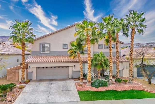404 Via Sonador, Henderson, NV 89012 - mediterranean / spanish house featuring stucco siding, concrete driveway, and a garage