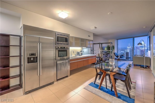 3726 Las Vegas Blvd Unit 3105, Las Vegas, NV 89158 - kitchen with built in appliances, light tile patterned flooring, modern cabinets, a sink, and light countertops