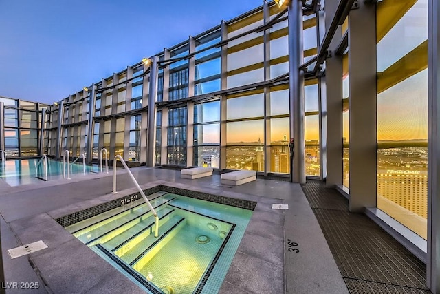 3726 Las Vegas Blvd Unit 3105, Las Vegas, NV 89158 - pool at dusk featuring a community hot tub and a community pool