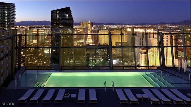 3726 Las Vegas Blvd Unit 3105, Las Vegas, NV 89158 - pool at dusk with a city view and a mountain view