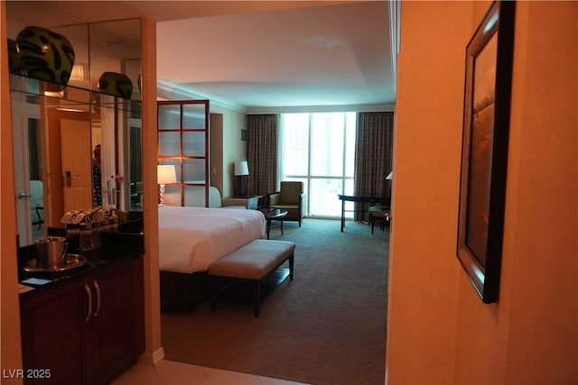 145 E Harmon Ave Unit 27619, Las Vegas, NV 89109 - bedroom with carpet floors and ornamental molding