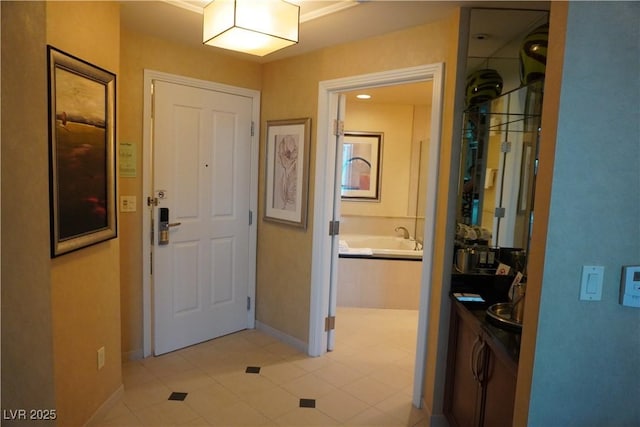145 E Harmon Ave Unit 27619, Las Vegas, NV 89109 - foyer entrance with baseboards and light tile patterned flooring