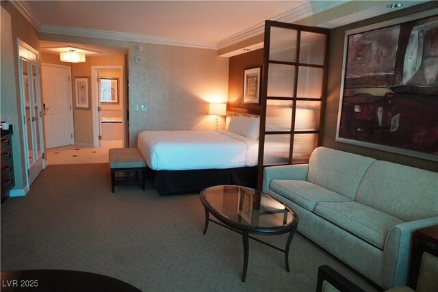 145 E Harmon Ave Unit 27619, Las Vegas, NV 89109 - carpeted bedroom featuring ornamental molding