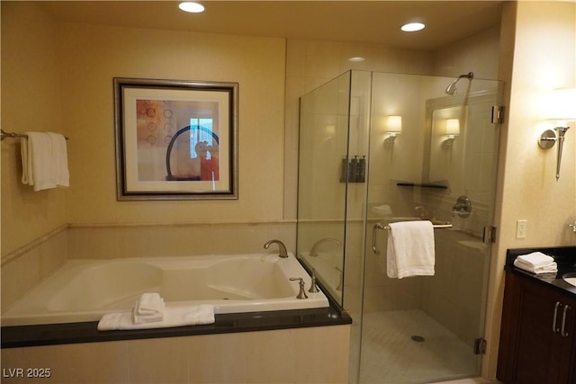 145 E Harmon Ave Unit 27619, Las Vegas, NV 89109 - full bath with vanity, a bath, a stall shower, and recessed lighting