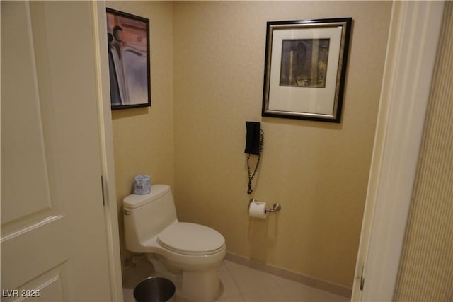 145 E Harmon Ave Unit 27619, Las Vegas, NV 89109 - bathroom featuring toilet, tile patterned flooring, and baseboards