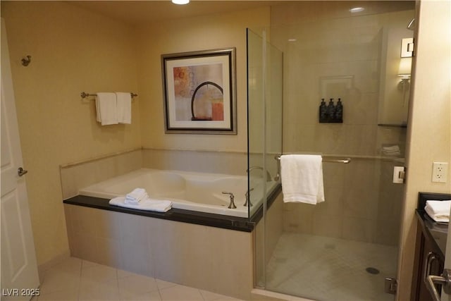 145 E Harmon Ave Unit 27619, Las Vegas, NV 89109 - full bath with tile patterned flooring, a bath, a shower stall, and vanity