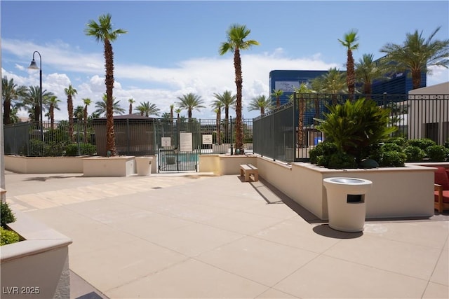 145 E Harmon Ave Unit 27619, Las Vegas, NV 89109 - view of patio / terrace with a gate