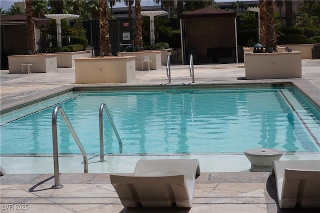 145 E Harmon Ave Unit 27619, Las Vegas, NV 89109 - community pool with a patio area