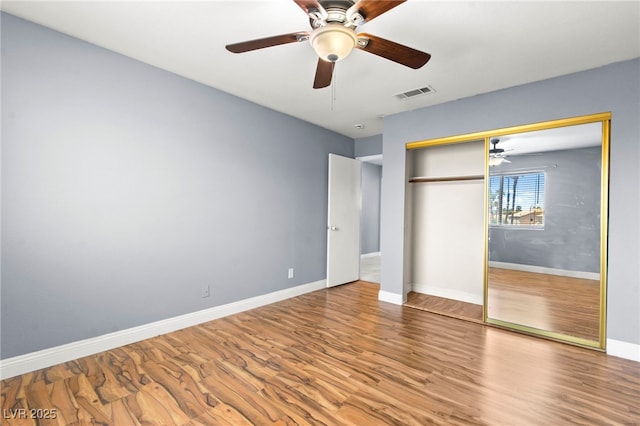 2062 Club Crest Way, Henderson, NV 89014 - unfurnished bedroom with wood finished floors, baseboards, a closet, and a ceiling fan