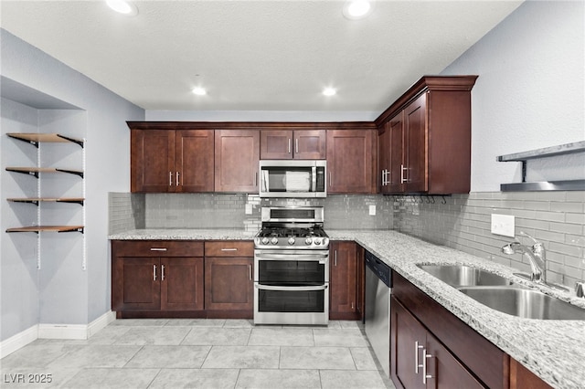 2062 Club Crest Way, Henderson, NV 89014 - kitchen with appliances with stainless steel finishes, a sink, backsplash, recessed lighting, and light tile patterned floors