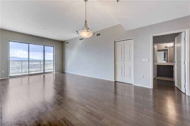 8255 S Las Vegas Blvd Unit 1816, Las Vegas, NV 89123 - empty room with dark wood-style flooring and baseboards