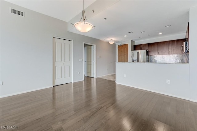 8255 S Las Vegas Blvd Unit 1816, Las Vegas, NV 89123 - unfurnished living room with wood finished floors, baseboards, and recessed lighting