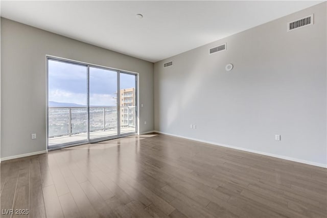 8255 S Las Vegas Blvd Unit 1816, Las Vegas, NV 89123 - spare room featuring wood finished floors and baseboards