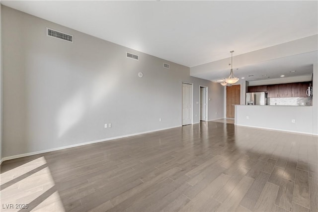 8255 S Las Vegas Blvd Unit 1816, Las Vegas, NV 89123 - unfurnished living room featuring wood finished floors and baseboards
