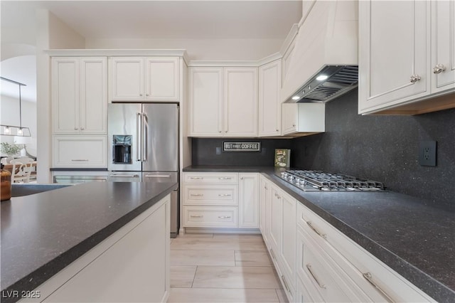 8504 Mystic Night Ave, Las Vegas, NV 89143 - kitchen featuring custom exhaust hood, appliances with stainless steel finishes, decorative backsplash, white cabinetry, and a sink