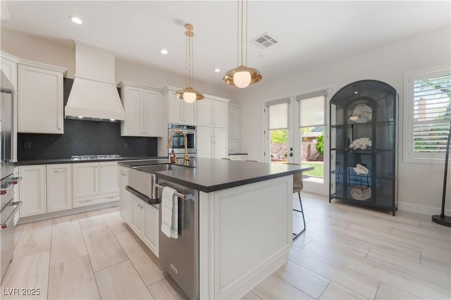 8504 Mystic Night Ave, Las Vegas, NV 89143 - kitchen with stainless steel appliances, dark countertops, a sink, decorative backsplash, and french doors